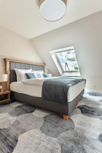 Säng eller sängar i ett rum på Hotel & Restaurant Rödersaal