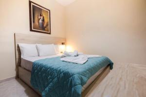 Posteľ alebo postele v izbe v ubytovaní Mavros Molos Seaside Apartment