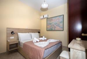Posteľ alebo postele v izbe v ubytovaní Mavros Molos Seaside Apartment