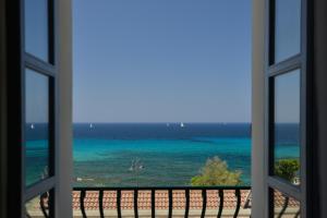 a view of the ocean from a window at Casa Alice in Alghero