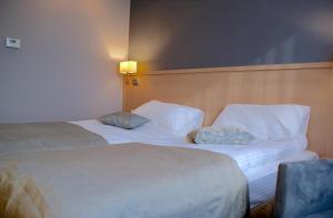 Posteľ alebo postele v izbe v ubytovaní Hotel Lazur SPA & Conference
