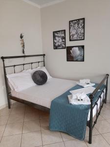 a bedroom with a bed with two pillows on it at Maria's Apartment Nafplio in Nafplio