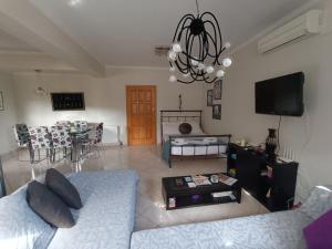 a living room with a couch and a table at Maria's Apartment Nafplio in Nafplio