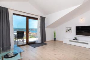 a living room with a view of the ocean at Apartments Otia Seaview in Porat