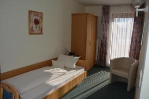 Postel nebo postele na pokoji v ubytování Kurpension Gundula