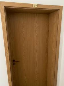 a wooden door with a sign on top of it at Dadi Oazis Ravda in Ravda +23 photos