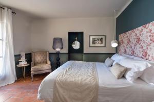 Postel nebo postele na pokoji v ubytování Château De Siran - Hôtel & Spa