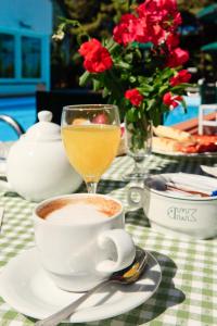 a table with a cup of coffee and a drink at Hotel Kyrie Isole Tremiti in San Domino