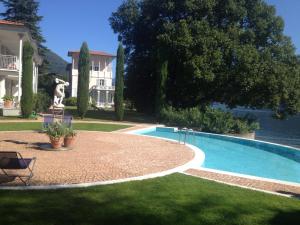 Der Swimmingpool an oder in der Nähe von Residence Ville Lago Lugano