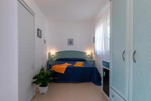 Postel nebo postele na pokoji v ubytování Albergo Villa A Mare