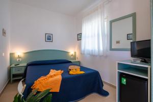Postel nebo postele na pokoji v ubytování Albergo Villa A Mare