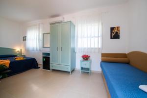 Postel nebo postele na pokoji v ubytování Albergo Villa A Mare