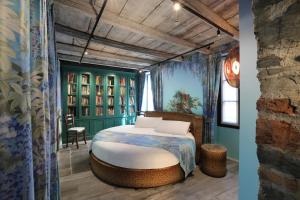 Postel nebo postele na pokoji v ubytování Suites&Atelier Lake Como