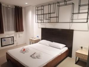 Postel nebo postele na pokoji v ubytování Hotel Rupert A Baler