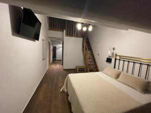 Postel nebo postele na pokoji v ubytování Hotel Casa Beletri