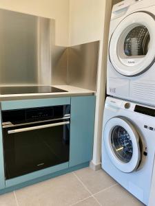Kuchyňa alebo kuchynka v ubytovaní Mimosas - Bel appartement avec une vue imprenable sur la baie