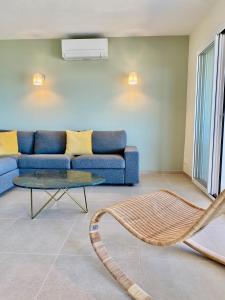 Posedenie v ubytovaní Mimosas - Bel appartement avec une vue imprenable sur la baie