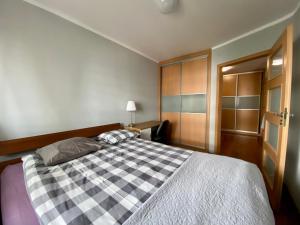 Posteľ alebo postele v izbe v ubytovaní Apartament Witawa 22