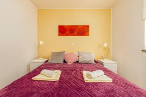 Postel nebo postele na pokoji v ubytování Apartments Hortensia