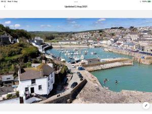 a view of a harbor with boats in the water at Bosloe in Helston