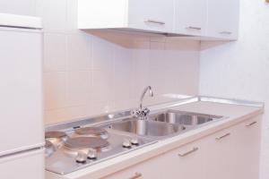 Kuchyňa alebo kuchynka v ubytovaní Casa vacanze La Maddalena