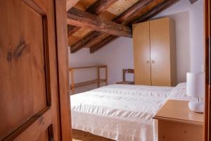 Posteľ alebo postele v izbe v ubytovaní Casa vacanze La Maddalena