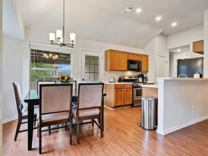 a kitchen with a table and chairs and a dining room at Cozy Getaway, Minutes from Austin! in Round Rock