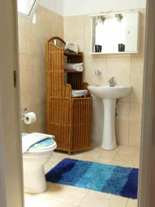 a bathroom with a toilet and a sink at Kedrodasos House in Elafonisi