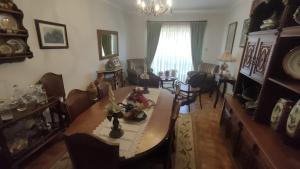 a living room with a dining room table and chairs at Casa do Artesanato in Vila Nova de Cerveira