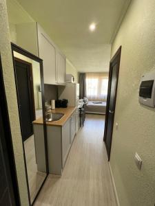 a kitchen with a sink and a counter top at Ostas ielas apartamenti in Saulkrasti