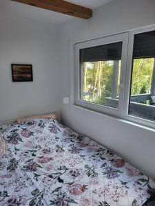 Postel nebo postele na pokoji v ubytování Zacisze Huta