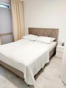 Postel nebo postele na pokoji v ubytování Pokoje Lejla