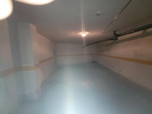 an empty room with a light on the ceiling at Alojamento Valverde in Nazaré