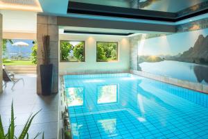 a swimming pool in a house at Hotel Garni Nachtigall in Schenna