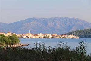 a town on the shore of a large body of water at Asteri Apartments Mytikas 2-Bedroom Seaview Courtyard in Mitika