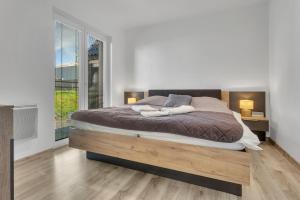 Postel nebo postele na pokoji v ubytování Family Apartments Klínovec