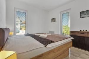Postel nebo postele na pokoji v ubytování Family Apartments Klínovec