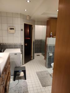 a bathroom with a sink and a toilet at Sun in Närpiö +43 photos