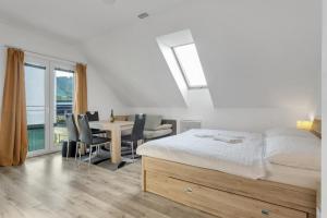 Postel nebo postele na pokoji v ubytování Family Apartments Klínovec