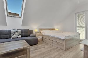 Postel nebo postele na pokoji v ubytování Family Apartments Klínovec