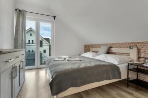 Postel nebo postele na pokoji v ubytování Family Apartments Klínovec