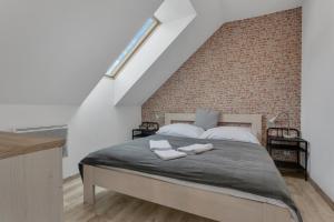 Postel nebo postele na pokoji v ubytování Family Apartments Klínovec