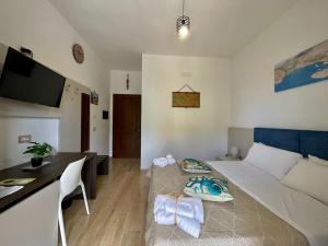 Televízia a/alebo spoločenská miestnosť v ubytovaní Bellavista Rooms
