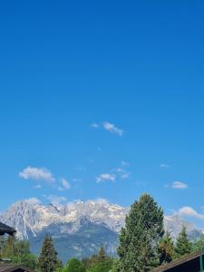 a view of the mountains from a house at Gästehaus Gamsblick in Werfenweng