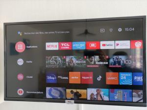 a television screen with a bunch of logos on it at Les lumières du phare in Calais