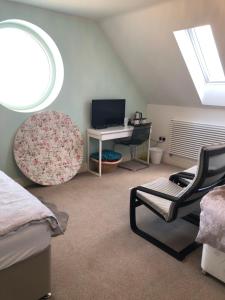 a bedroom with a bed and a desk and a window at Lillium House in Stockton-on-Tees