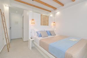 Ein Bett oder Betten in einem Zimmer der Unterkunft Elite Suites Naxos