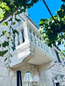 a balcony on the side of a building at Jakov Apartments in Orebić