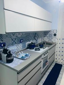 A kitchen or kitchenette at Casa Limoni al mare tra Catania Etna e Taormina
