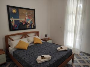 Llit o llits en una habitació de Villetta Gallipoli Baia Verde Tigli 33